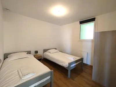Un ou plusieurs lits dans un hébergement de l'établissement Le 42 - Second Souffle - Bretteville