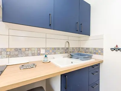Cuisine ou kitchenette dans l'établissement Holiday Home la Rivière by Interhome