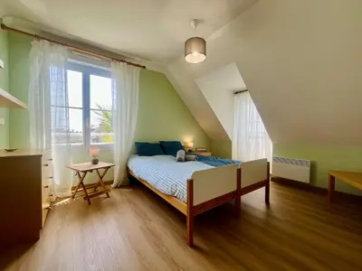 Un ou plusieurs lits dans un hébergement de l'établissement Les pieds dans l eau Home - Waterfront Stay
