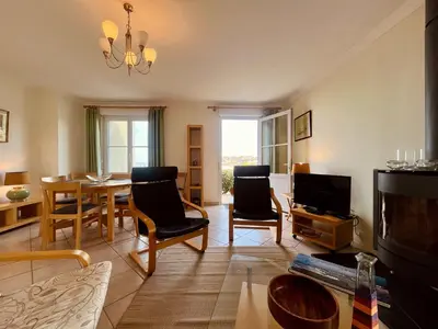 Coin salon dans l'établissement Les pieds dans l eau Home - Waterfront Stay