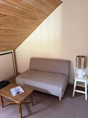 Coin salon dans l'établissement Le Loft Corail
