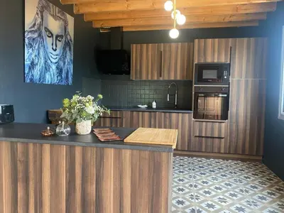 Cuisine ou kitchenette dans l'établissement Le Loft Corail