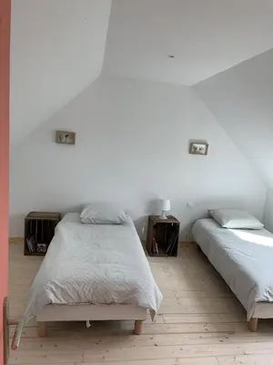 Un ou plusieurs lits dans un hébergement de l'établissement Les Petits Crapauds Gîte