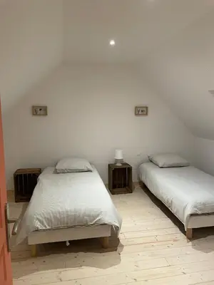 Un ou plusieurs lits dans un hébergement de l'établissement Les Petits Crapauds Gîte