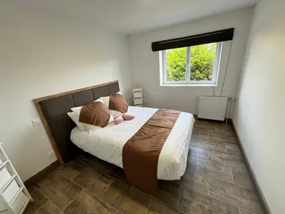 Un ou plusieurs lits dans un hébergement de l'établissement Maison de Vacances du Bouquet