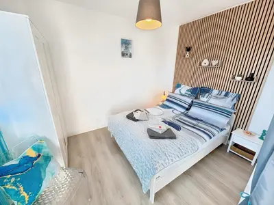 Un ou plusieurs lits dans un hébergement de l'établissement La croisette - à 50 mètres de la plage de Juno Beach avec Balcon et Stationnement gratuit