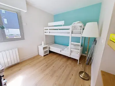 Un ou plusieurs lits dans un hébergement de l'établissement Appartement rez-de-jardin proche mer, 4 couchages - FR-1-746-31