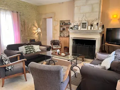 Coin salon dans l'établissement Au Pavillon du Château - Mer & Plage Juno Beach