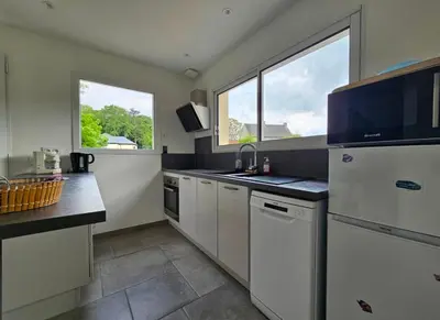 Cuisine ou kitchenette dans l'établissement Maison détente