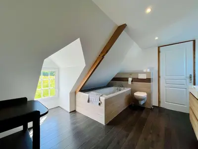 Un ou plusieurs lits dans un hébergement de l'établissement Le Gite de la Fontaine - Spacious house