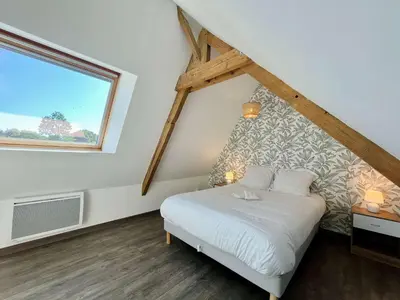 Un ou plusieurs lits dans un hébergement de l'établissement Le Gite de la Fontaine - Spacious house