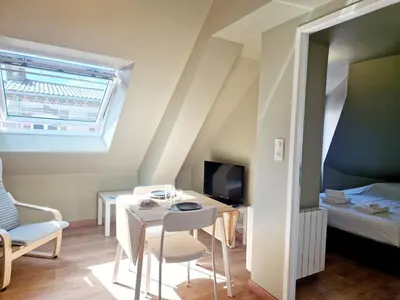 Télévision ou salle de divertissement dans l'établissement L'Ermitage Cosy