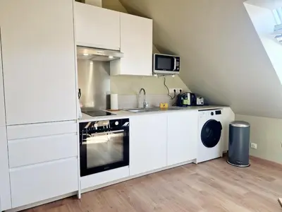 Cuisine ou kitchenette dans l'établissement L'Ermitage Cosy