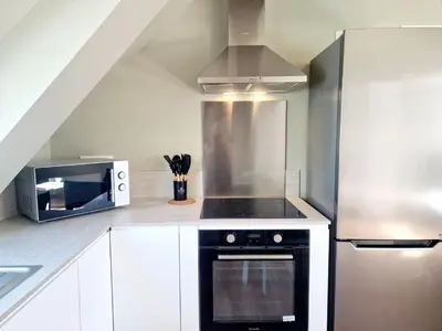 Cuisine ou kitchenette dans l'établissement L'Ermitage Smart