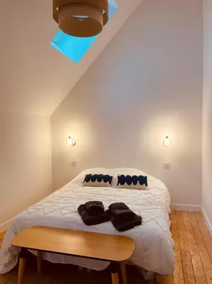 Un ou plusieurs lits dans un hébergement de l'établissement Maison Yodée