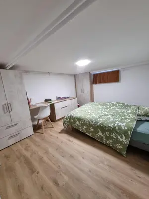 Un ou plusieurs lits dans un hébergement de l'établissement Granville, sous-sol aménagé en bel appartement