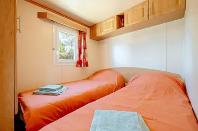 Un ou plusieurs lits dans un hébergement de l'établissement Mobile Home - 700m de la plage