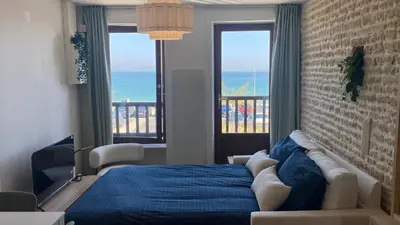 Un ou plusieurs lits dans un hébergement de l'établissement L'Hirondelle, charmante maisonnette vue mer