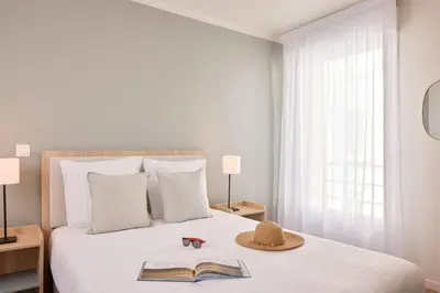 Un ou plusieurs lits dans un hébergement de l'établissement Quality Aparthotel Cherbourg