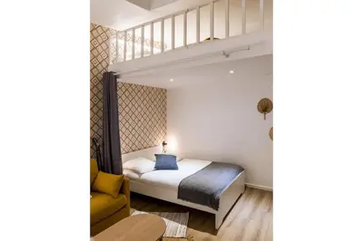 Un ou plusieurs lits dans un hébergement de l'établissement 4-person apartment, city center