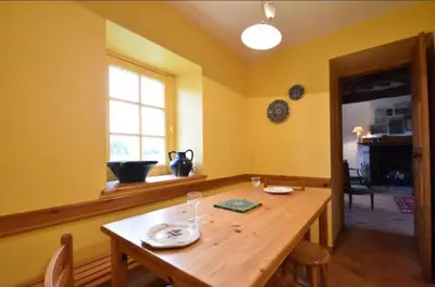Télévision ou salle de divertissement dans l'établissement Gîte du Netz