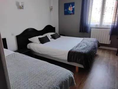 Un ou plusieurs lits dans un hébergement de l'établissement La Grandcopaise Chambres et Studios