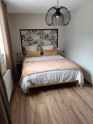 Un ou plusieurs lits dans un hébergement de l'établissement Appartement Camélia