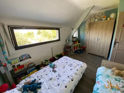 Un ou plusieurs lits dans un hébergement de l'établissement La maison normande
