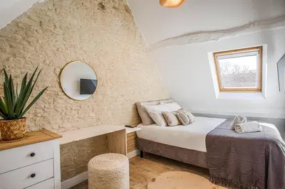 Un ou plusieurs lits dans un hébergement de l'établissement Maison Spa et Sauna, Cœur de la Normandie