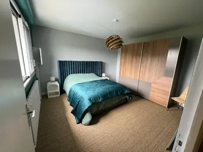 Un ou plusieurs lits dans un hébergement de l'établissement Maison 8 personnes vue sur le havre