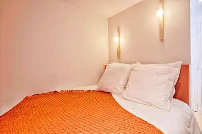 Un ou plusieurs lits dans un hébergement de l'établissement Le Saint-Sauveur - Chaleureux 2 pièces - Vidéoprojecteur