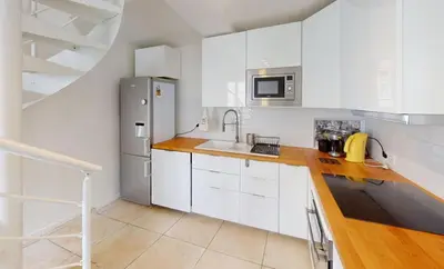 Cuisine ou kitchenette dans l'établissement Charme, plage & tout à pied