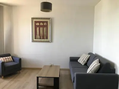 Coin salon dans l'établissement Port de la Houle vue mer - appartement 55 m2 - 1 chambre