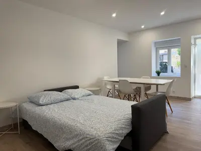Un ou plusieurs lits dans un hébergement de l'établissement Maison de charme sur la côte