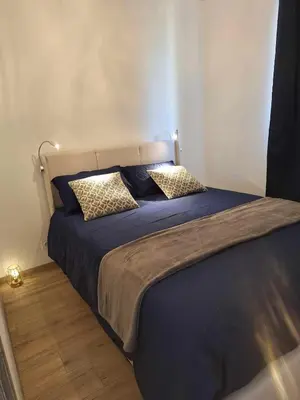 Un ou plusieurs lits dans un hébergement de l'établissement Appartement spacieux à Monfréville avec terrasse