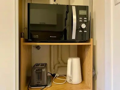 Cuisine ou kitchenette dans l'établissement Le Saint-Lois