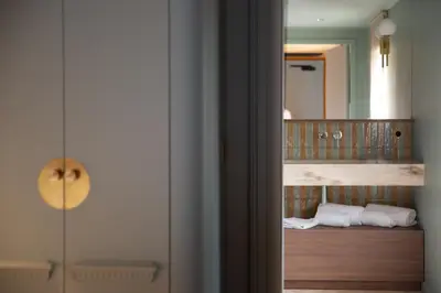 Un ou plusieurs lits dans un hébergement de l'établissement Hôtel La Particulière