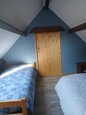 Un ou plusieurs lits dans un hébergement de l'établissement Chalet 5 personnes proche de la mer à Merville-Franceville-Plage