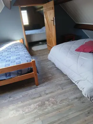 Un ou plusieurs lits dans un hébergement de l'établissement Chalet 5 personnes proche de la mer à Merville-Franceville-Plage
