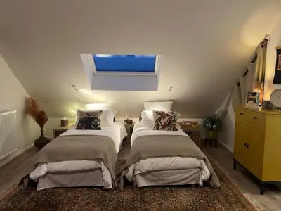 Un ou plusieurs lits dans un hébergement de l'établissement Chambre Forêt du Domaine de la Belle Verte