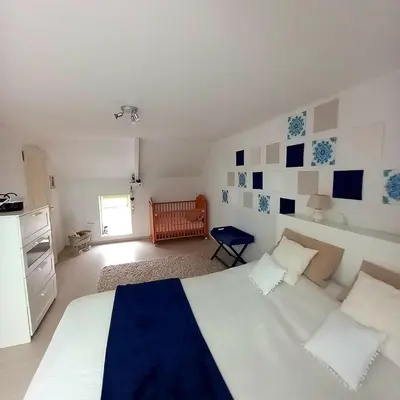 Un ou plusieurs lits dans un hébergement de l'établissement House for 9 people
