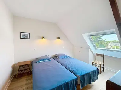 Un ou plusieurs lits dans un hébergement de l'établissement Appartement en bord de mer, 1 chambre, 4 couchages, parking privé - FR-1-361-570