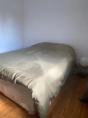 Un ou plusieurs lits dans un hébergement de l'établissement Appartement chaleureux et accueillant à quelques pas de la mer