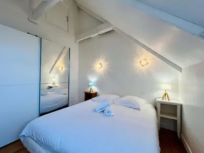 Un ou plusieurs lits dans un hébergement de l'établissement La Petite Cachette de Grandcamp - Seafront view