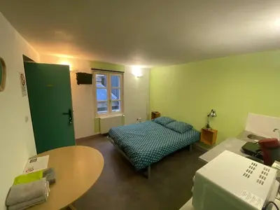 Un ou plusieurs lits dans un hébergement de l'établissement Studio cosy à Cherbourg-en-Cotentin - 15 m²