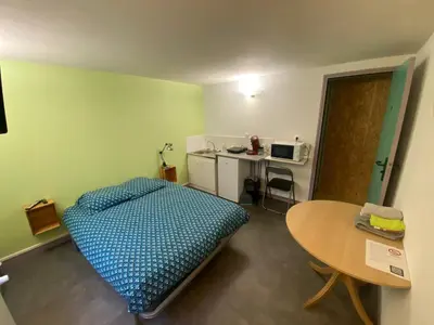 Un ou plusieurs lits dans un hébergement de l'établissement Studio cosy à Cherbourg-en-Cotentin - 15 m²