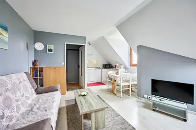 Télévision ou salle de divertissement dans l'établissement Le Nid Marin - A 400m de la plage