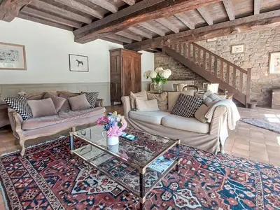 Coin salon dans l'établissement Holiday Home La Grulais by Interhome