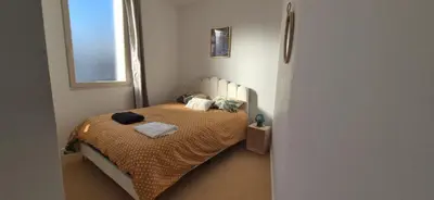 Un ou plusieurs lits dans un hébergement de l'établissement Maison de ville Saint Paul 2 Chambres