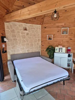 Un ou plusieurs lits dans un hébergement de l'établissement Chalet cosy